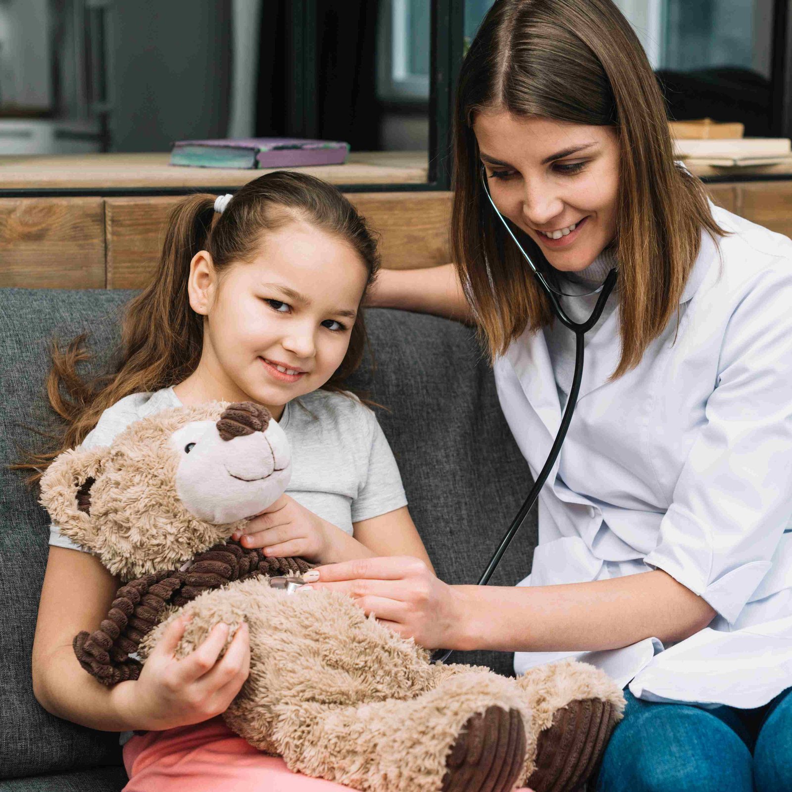 portrait girl examining teddy bear with stethoscope 11zon