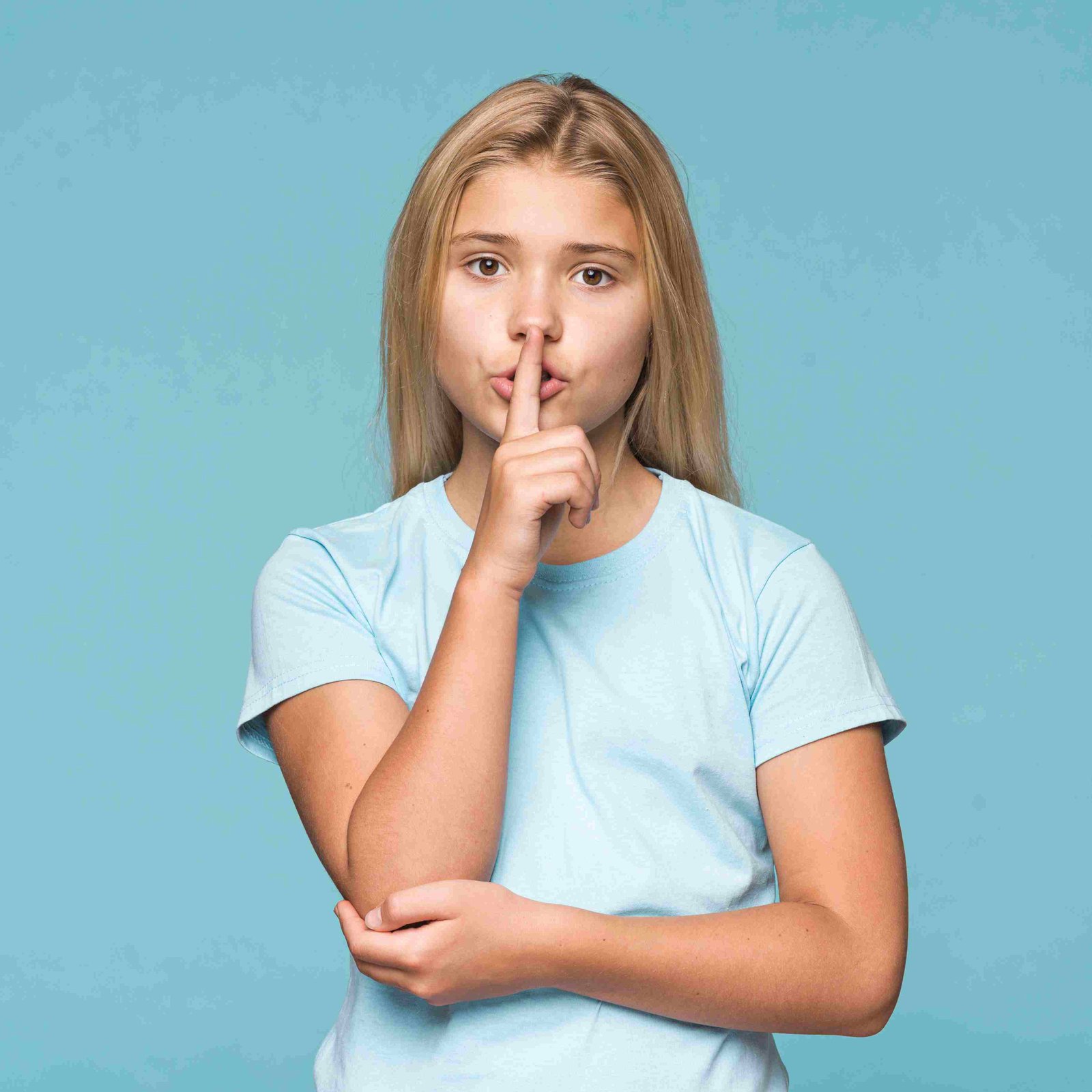 young girl showing silence sign 11zon